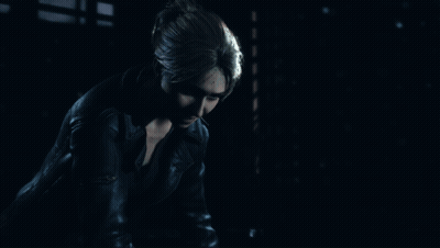 Woman In Leather Jacket In Dark Room GIF
