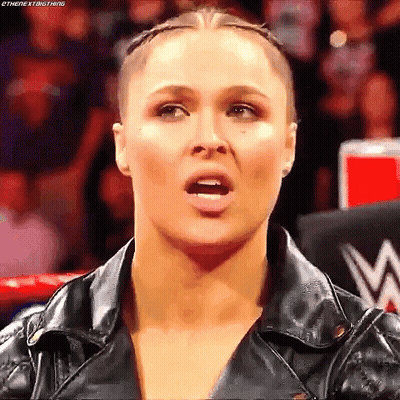 Woman In Leather Jacket Making Funny Face GIF