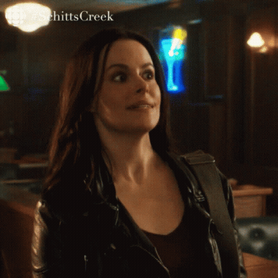 Woman In Leather Jacket Saying Yeah In Bar GIF