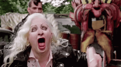 Woman In Leather Jacket Screaming At Mustache Statue GIF