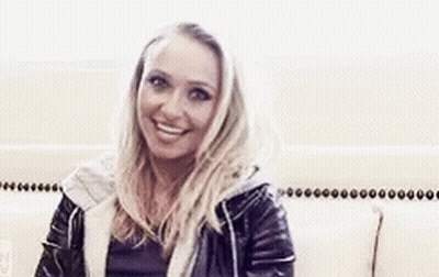 Woman In Leather Jacket Smiling At Camera GIF