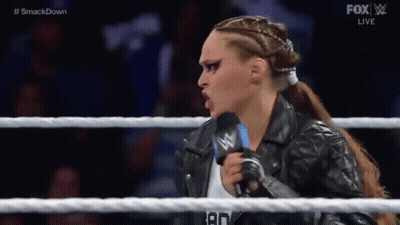 Woman in Leather Jacket Talking Into Microphone