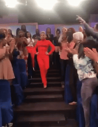 Woman In Leather Jacket Waving GIF