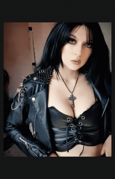 Woman In Leather Jacket With Spikes And Cross Necklace GIF