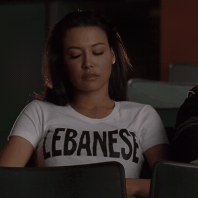 Woman In Lebanese T-Shirt Looking Down GIF