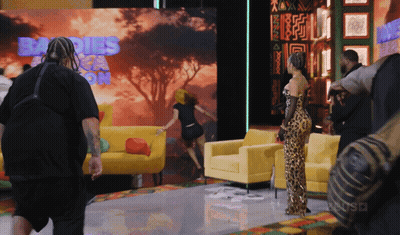 Woman In Leopard Print Dress Sign Saying Babies GIF