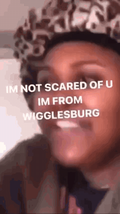 Woman In Leopard Print Hat Making Funny Face GIF