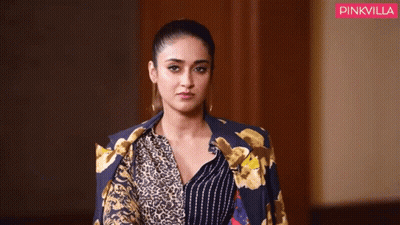 Woman In Leopard Print Jacket And Striped Shirt GIF