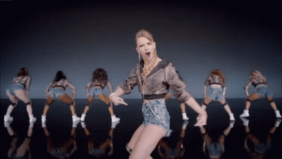 Woman In Leopard Print Jacket Dancing With Dancers GIF