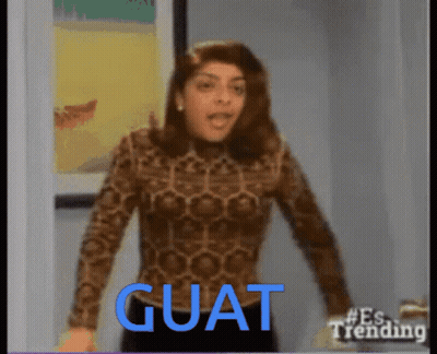 Woman In Leopard Print Shirt Standing In Front Of Guat Sign GIF