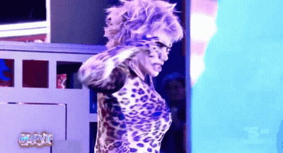 Woman In Leopard Print Standing Before #Gfvf Sign GIF