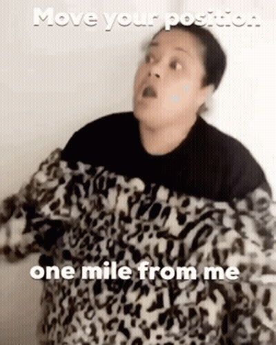 Woman In Leopard Print Sweater Says Move Your Position One Mile From Me GIF