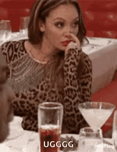 Woman In Leopard Print Sweater With Martini Glass And Drink GIF