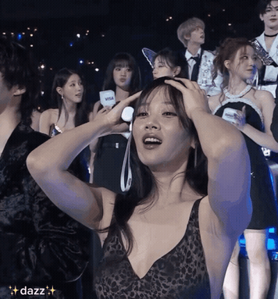 Woman In Leopard Print Top Holding Head GIF
