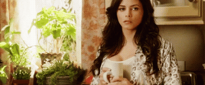 Woman In Leopard Robe Holding Coffee GIF