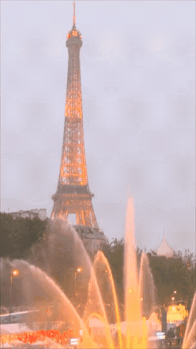 Woman In Long Black Dress With Gold Necklace GIF