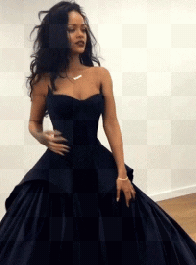 Woman In Long Black Dress With Gold Necklace GIF