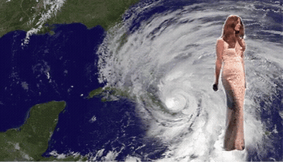 Woman In Long Dress In Front Of Hurricane GIF