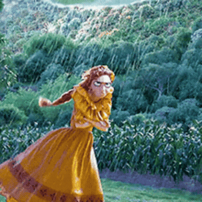 Woman In Long Yellow Dress Standing In Field GIF