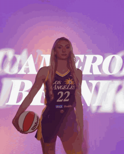 Woman In Los Angeles Basketball Uniform Holding Basketball GIF