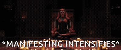 Woman In Lotus Position Surrounded By Candles Manifesting Intensifies GIF