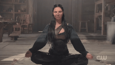Woman In Lotus Position With CW GIF