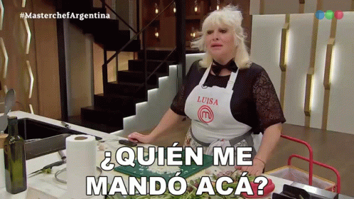 Woman In Luisa Apron At Kitchen Counter GIF