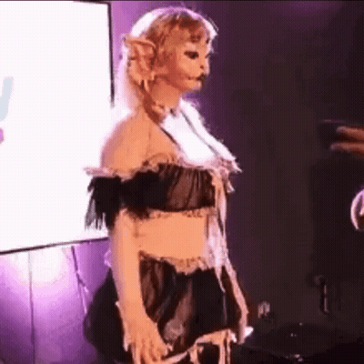 Woman In Maid Costume On Stage With Screen GIF