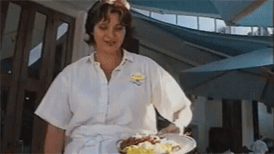 Woman In Maid Costume Standing Before Crowd GIF