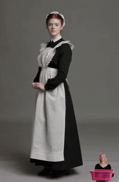 Woman In Maid Outfit Next To Pink Basket GIF