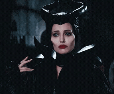 Woman In Maleficent Costume Holding Knife GIF