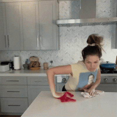 Woman In Man Picture T-Shirt Cleaning Counter GIF