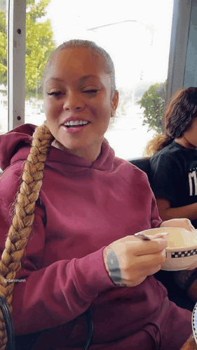 Woman In Maroon Hoodie Holding Coffee GIF