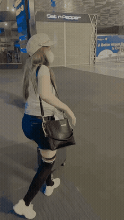 Woman In Mask And Levi's Shirt At Set N Pepper Store GIF
