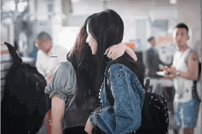 Woman In Mask And White Shirt Saying M & C GIF