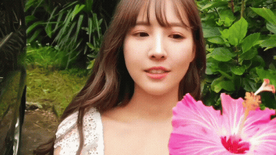 Woman In Mask Holding Book In Front Of Moot Sign GIF