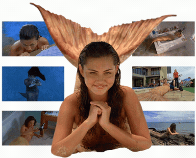 Woman In Mermaid Costume Surrounded By Mermaids GIF