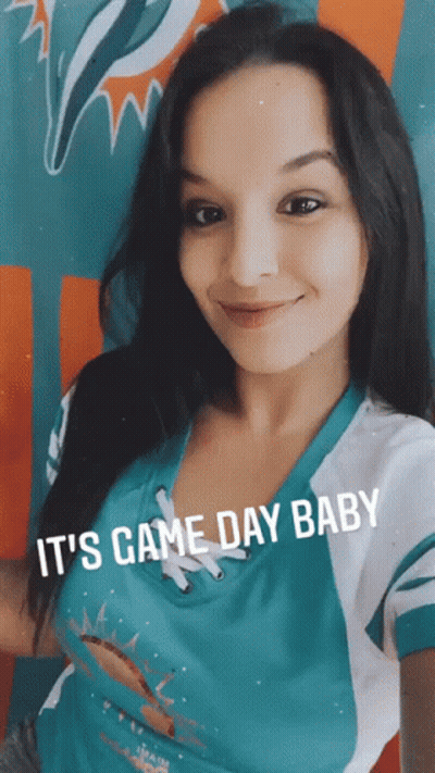 Woman In Miami Dolphins Shirt Smiling GIF