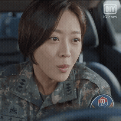 Woman In Military Uniform Sitting In Car GIF
