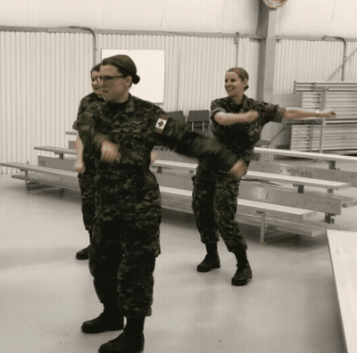 Woman In Military Uniform With Canadian Flag GIF