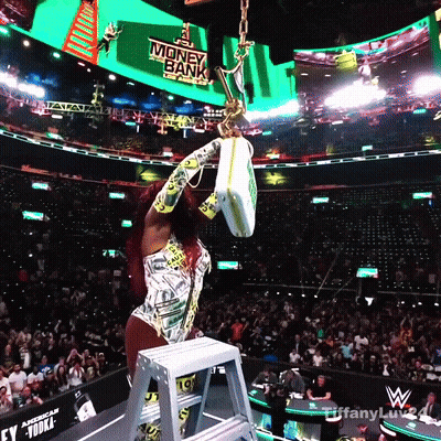 Woman In Money Bank Outfit On Ladder Holding Trophy GIF