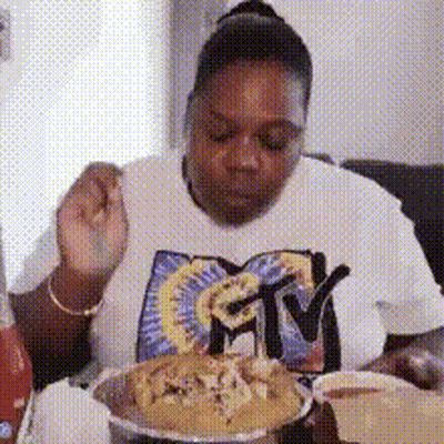 Woman In MTV Shirt Eating Meal GIF