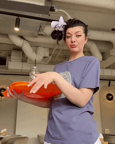 Woman in NASA T-Shirt Holding Orange Tray