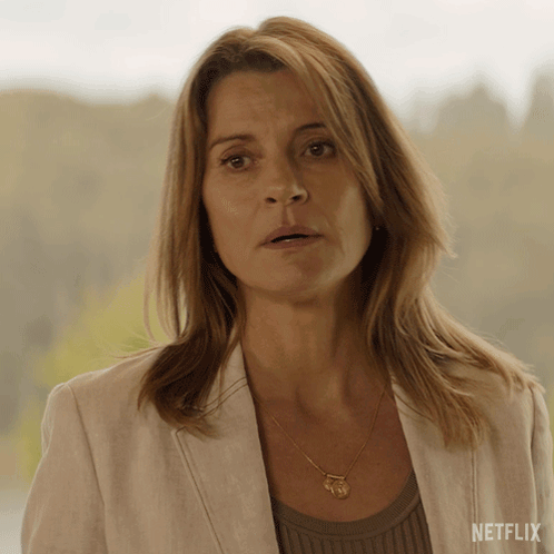 Woman In Necklace And White Jacket With Netflix GIF