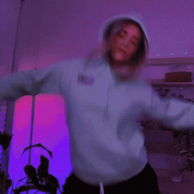 Woman In Neon Green Hoodie Dancing GIF