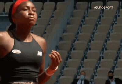 Woman In New Balance Tank Top Before Empty Seats GIF