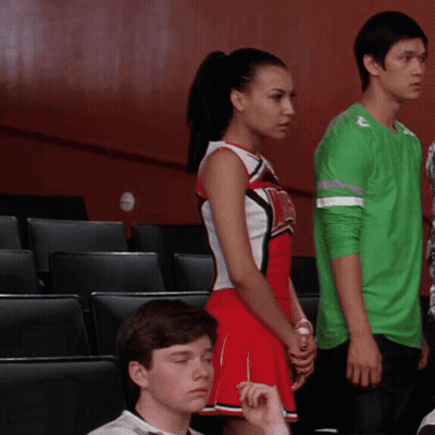 Woman In New York T-Shirt With Hands In Air GIF