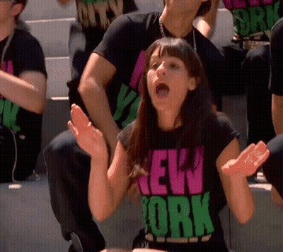 Woman In New York T-Shirt With Hands Up GIF