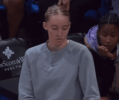 Woman In Nike Sweatshirt Sitting In Front Of Dr Scott & W Health Chair GIF