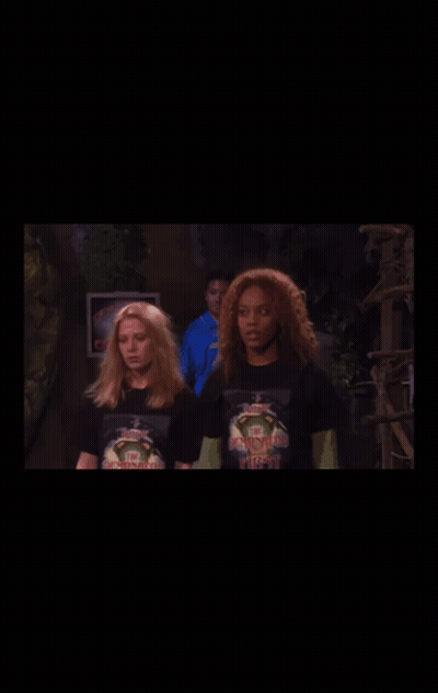 Woman In Ninja Turtles T-Shirt Next To Another Woman GIF